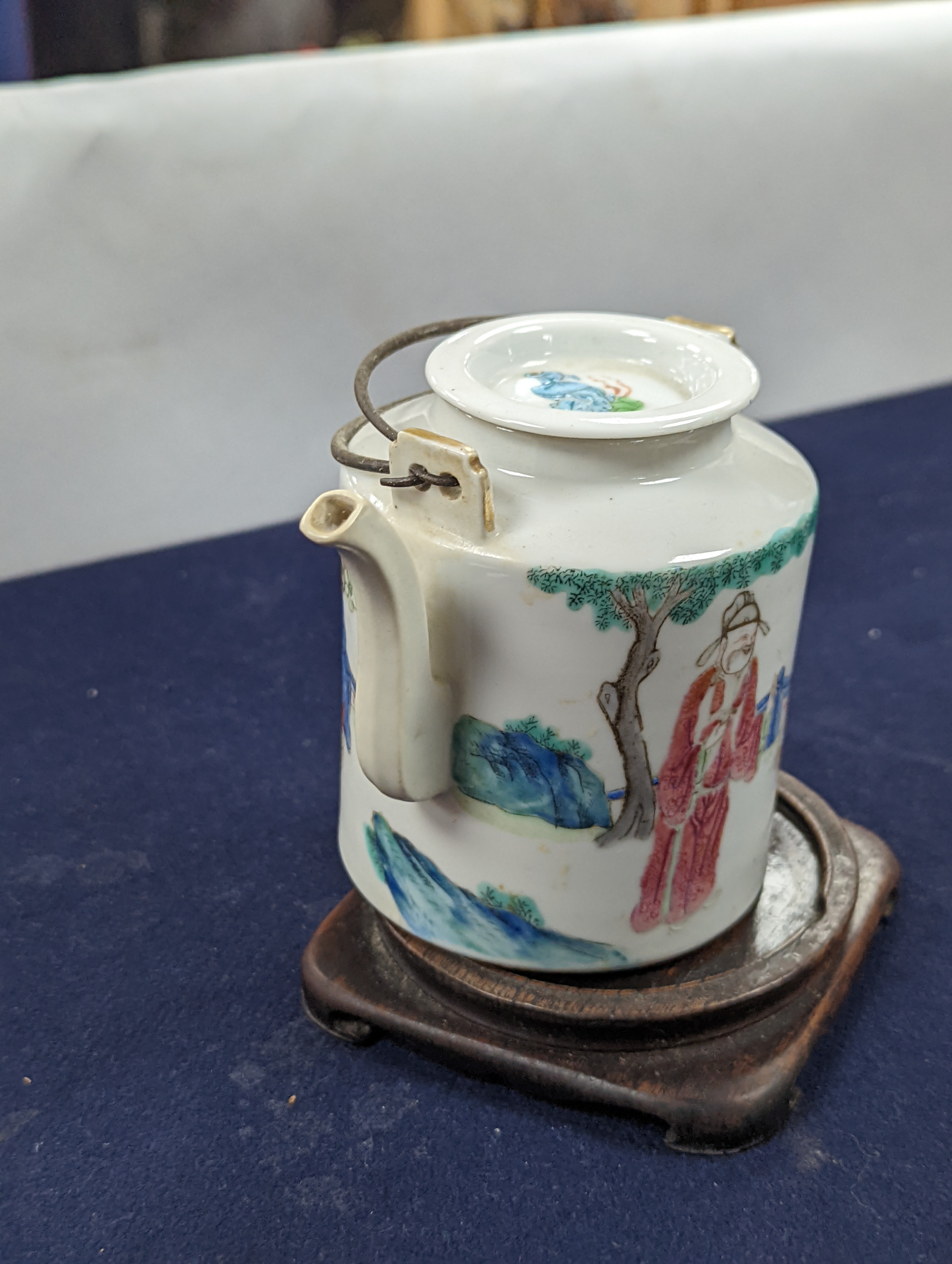 A Chinese famille rose cylindrical teapot and cover, 19th century 11cm, wood stand